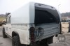 Land Rover Defender 130CC s nástavbou OM Canopies model Worker. Pohled zezadu.  