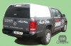 Vw Amarok DC s hardtopem model Mk.I. v bílé barvě. volkswagen amarok, hardtop